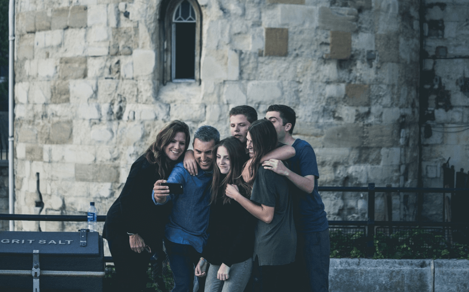 group of people taking selfie